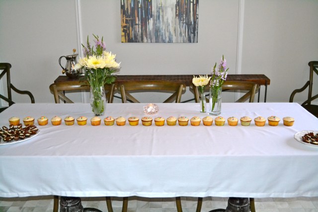 The beautiful line of cupcakes spelled out "Is it a boy or girl?"