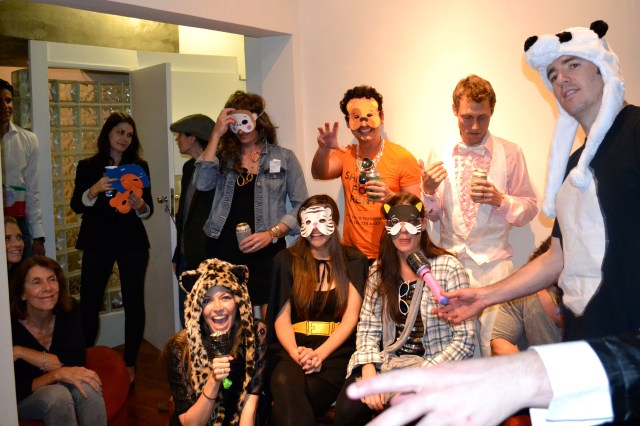 Getting ready to perform - handing out animal masks to the crowd.