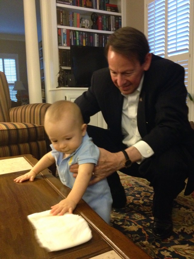Pasha helping Colt learn to walk around the table.