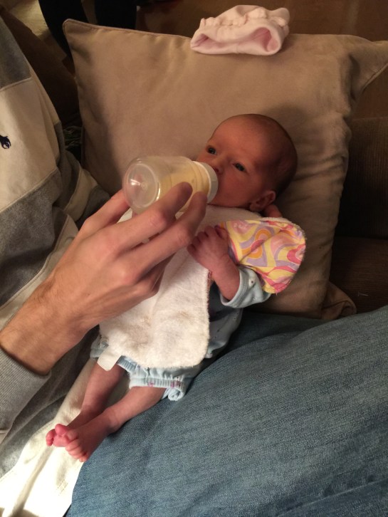 Brad feeding little May.