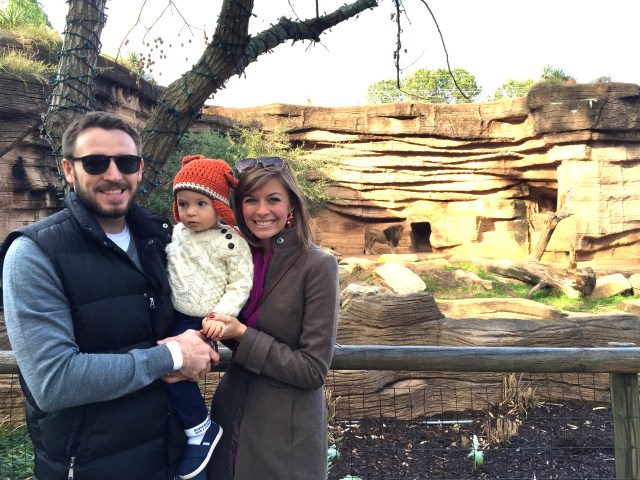 Family photo in front of the lions.