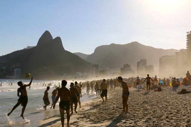 I love this shot because you can literally count 8 soccer balls in the air as you look down the beach. That is the beach in Brazil.