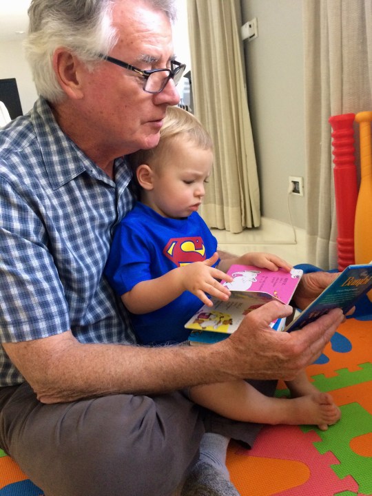 Ollie reading with Superman.