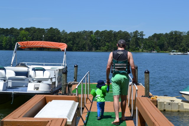 Michael walking little Colt out on the dock.