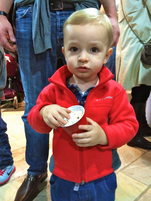 Trying popcorn for the first time at a friend's birthday party.