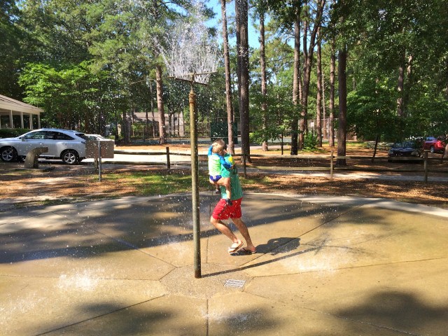 Running through the sprinkler with Dad.