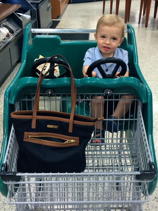 Colt loved driving around at the grocery store.