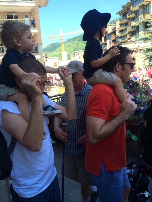 Colt and JJ captivated by the 4th of July parade.