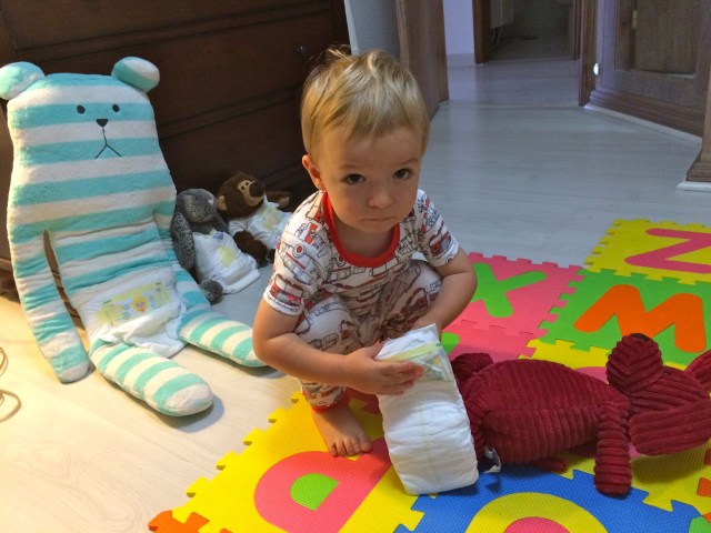 Little bed-head making sure everyone has a diaper on!