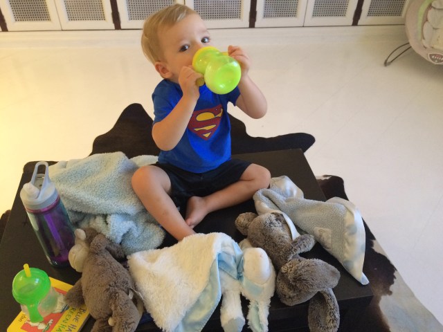 Superman sometimes likes to sit on the coffee table.
