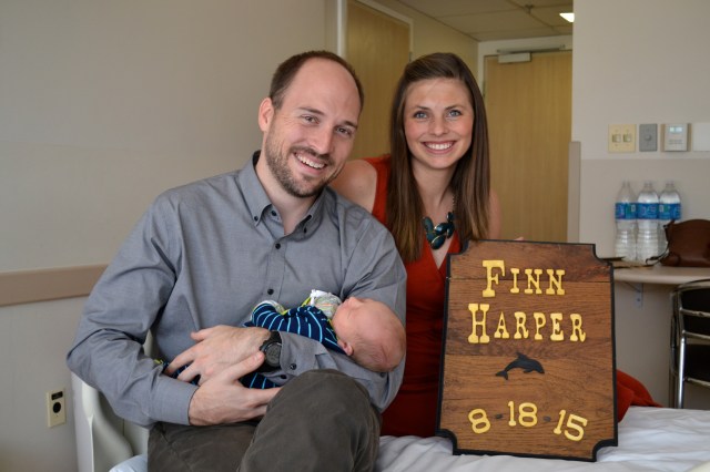 Finn meeting his Godparents, Trent & Paige Hudson! Trent made Finn a sign to match his big brother's! 