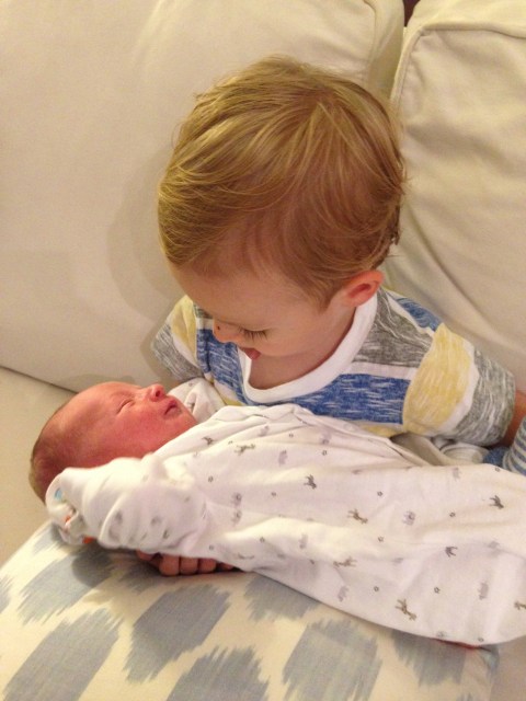 Colt loves holding his little brother.